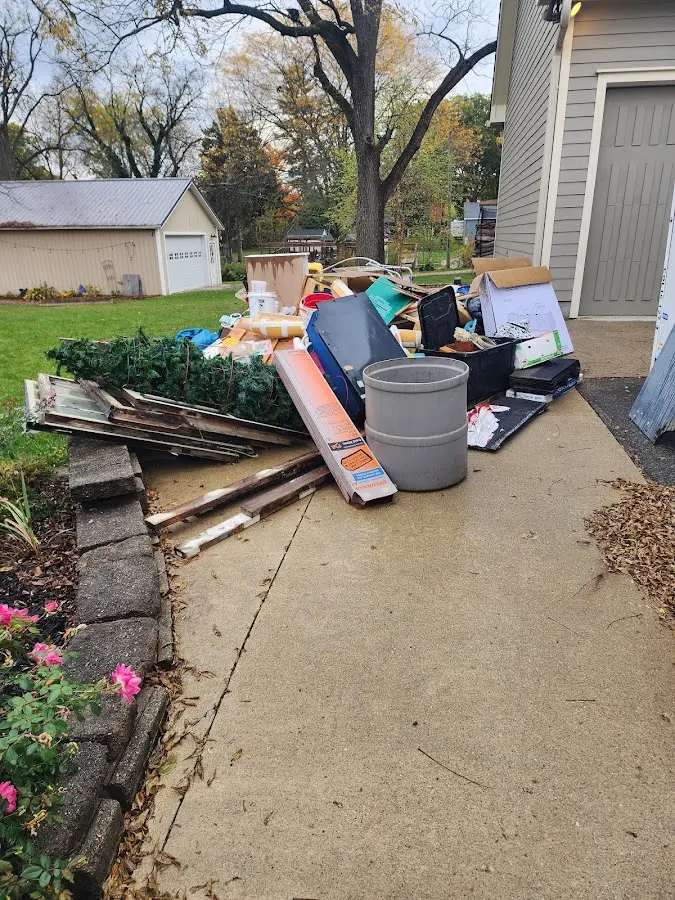Dumpster being loaded with debris for Commercial Dumpster Rental in Blackstone